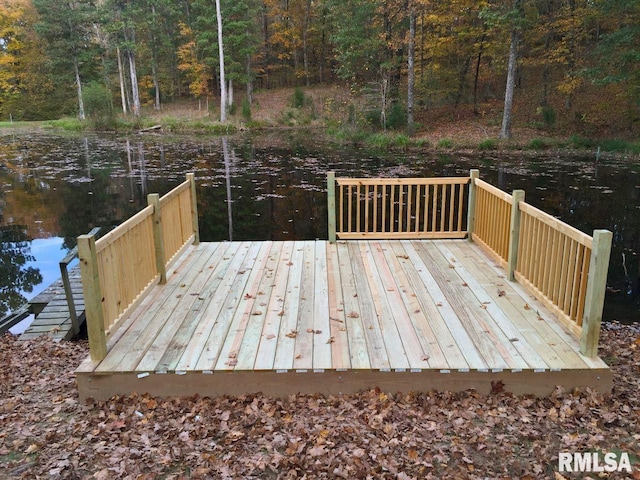 wooden deck with a water view