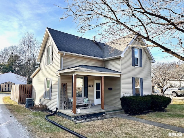 view of front facade featuring a porch and central AC unit