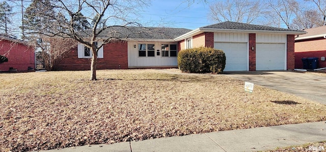 view of front of home with a garage and a front lawn