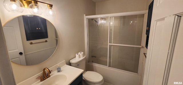 full bathroom with vanity, shower / bath combination with glass door, and toilet