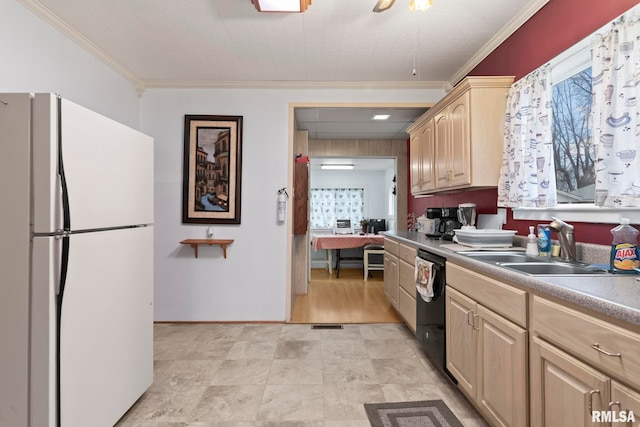 kitchen with white refrigerator, black dishwasher, a wealth of natural light, and light brown cabinetry