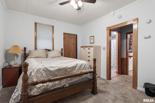 carpeted bedroom featuring ceiling fan and ornamental molding