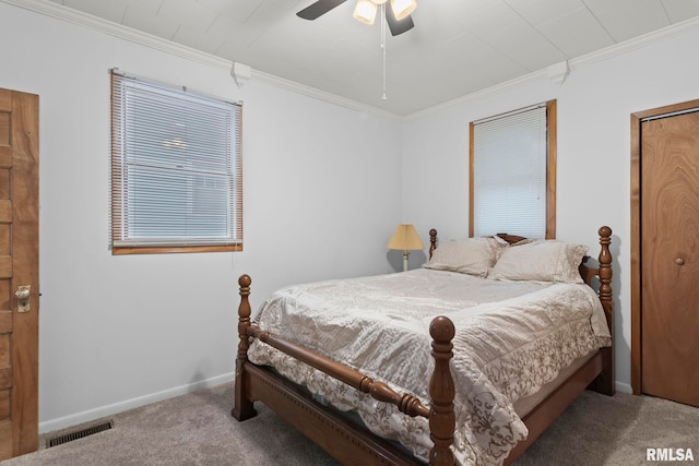 bedroom featuring crown molding, carpet, and ceiling fan