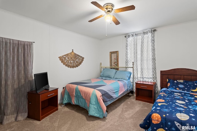 bedroom featuring light carpet and ceiling fan