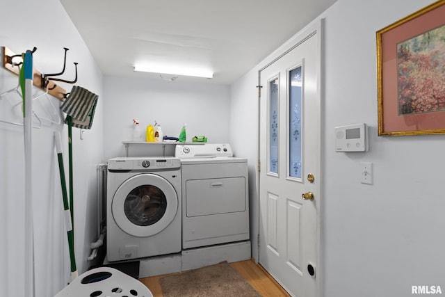 washroom featuring light hardwood / wood-style flooring and independent washer and dryer