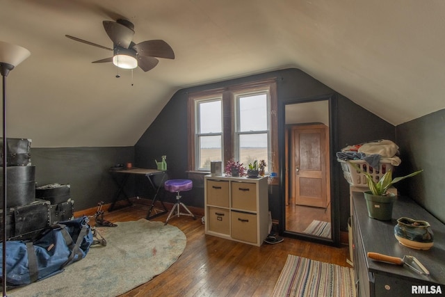 bonus room with ceiling fan, lofted ceiling, and dark hardwood / wood-style flooring