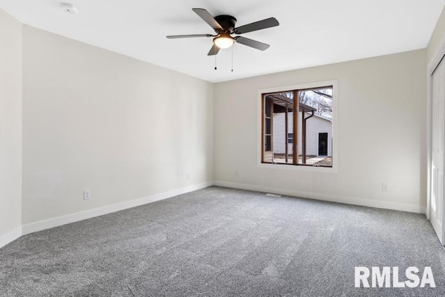 empty room with carpet floors and ceiling fan