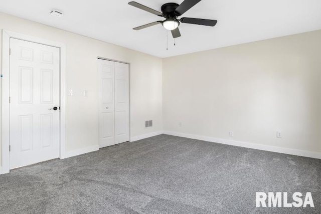 unfurnished bedroom featuring carpet, ceiling fan, and a closet