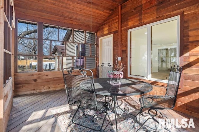 sunroom / solarium featuring wood ceiling and vaulted ceiling