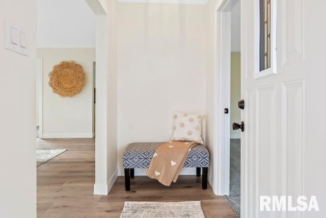 hallway with light hardwood / wood-style floors