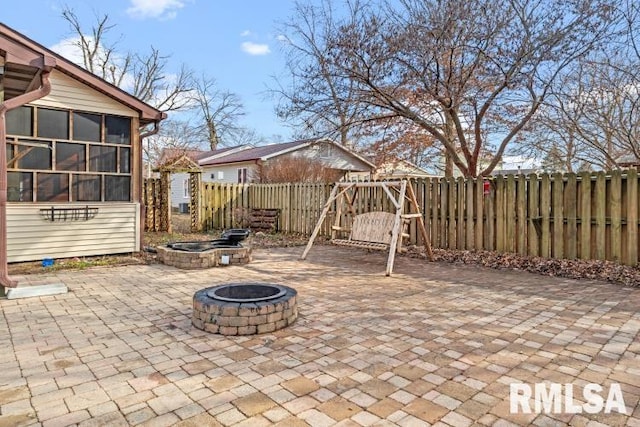 view of patio featuring a fire pit