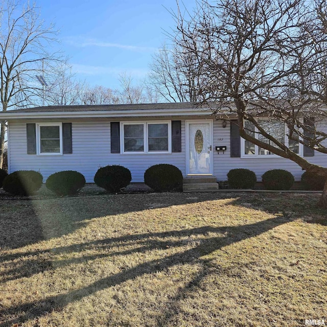 single story home with a front yard