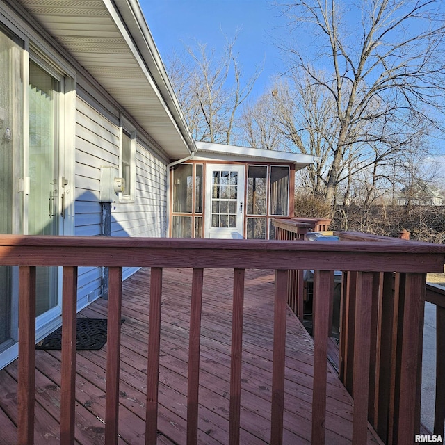 wooden terrace featuring a sunroom