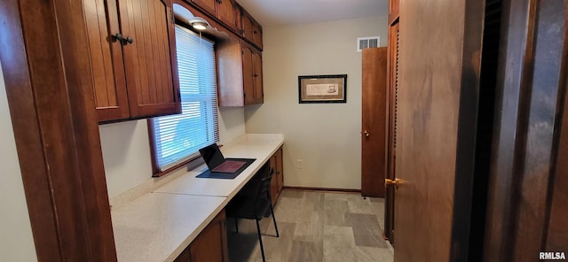 office area with light hardwood / wood-style floors