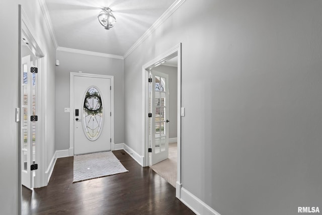 foyer entrance featuring ornamental molding and dark hardwood / wood-style floors