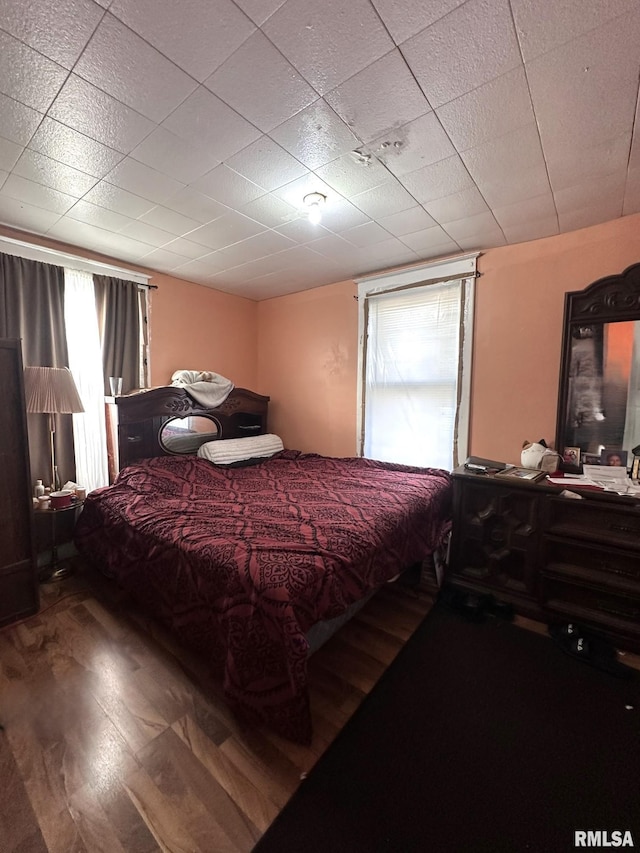 bedroom featuring wood finished floors