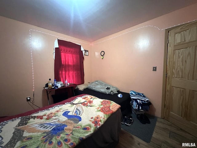 bedroom featuring wood finished floors