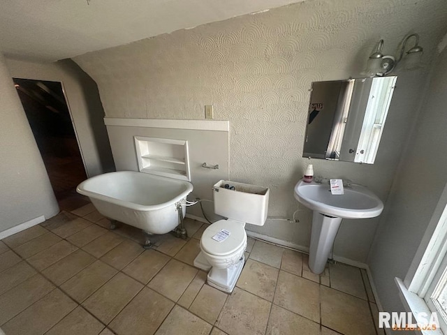 bathroom featuring tile patterned flooring and toilet