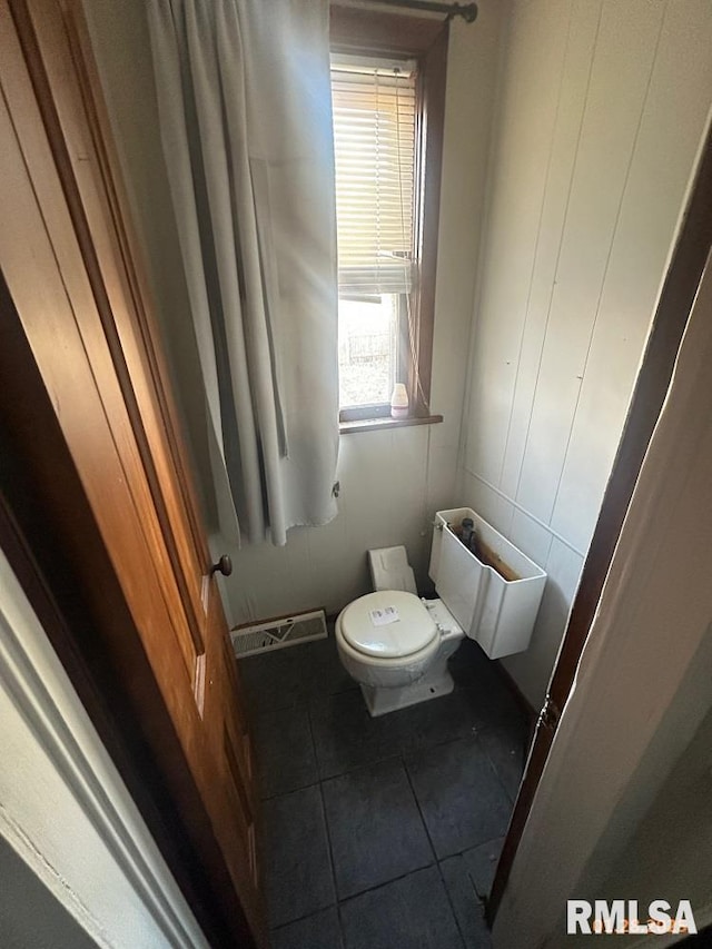 bathroom with tile patterned floors and toilet