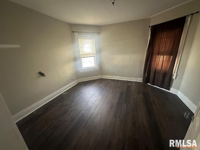 unfurnished room featuring dark hardwood / wood-style flooring