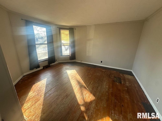 unfurnished room with dark wood-type flooring