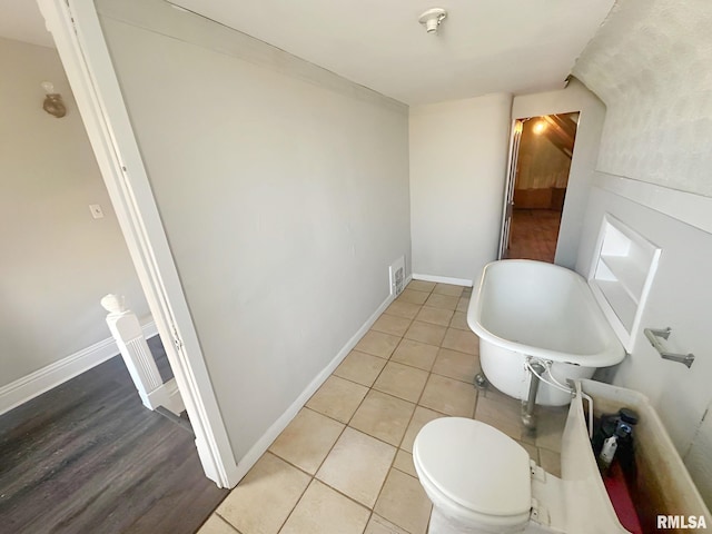 bathroom featuring visible vents, baseboards, and tile patterned floors