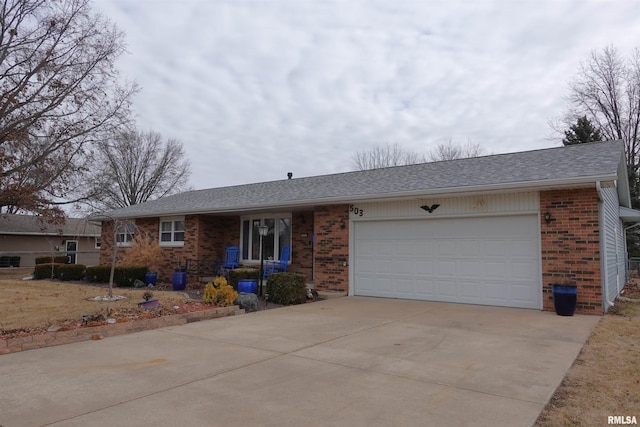 ranch-style house featuring a garage