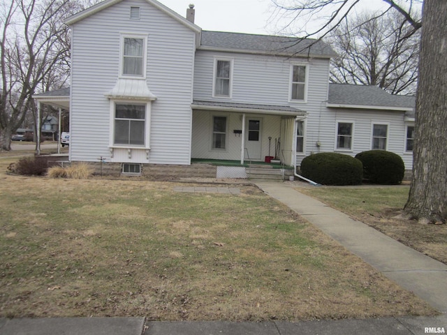 view of property featuring a front yard and a porch