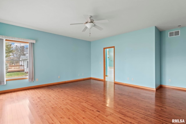 unfurnished room featuring hardwood / wood-style flooring and ceiling fan