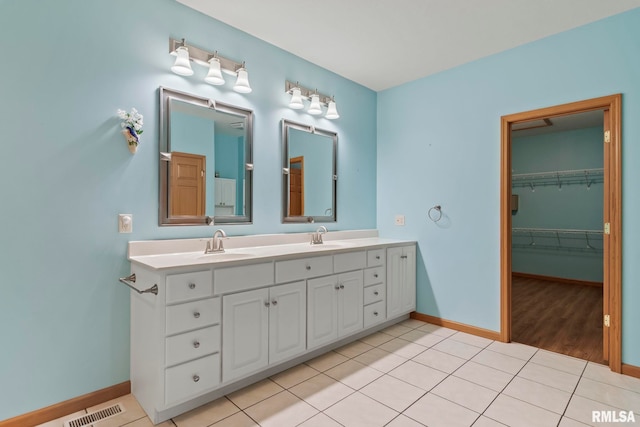 bathroom with vanity and tile patterned floors