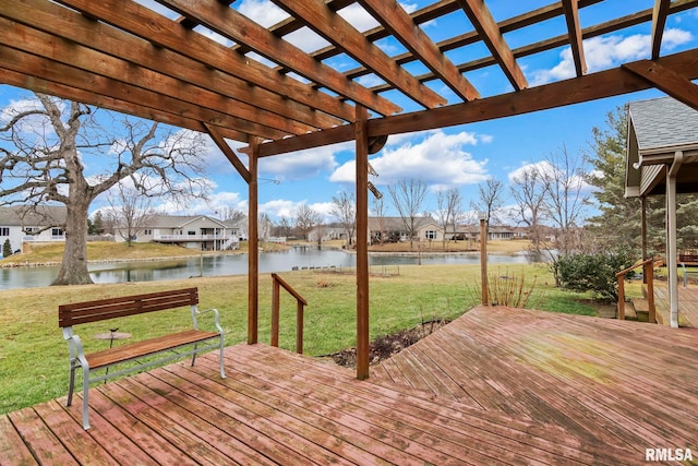 wooden deck featuring a water view, a yard, and a pergola