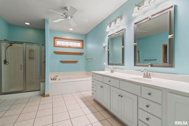 bathroom with ceiling fan, vanity, plus walk in shower, and tile patterned flooring