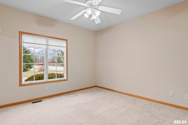 carpeted empty room with ceiling fan