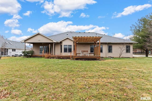 back of house featuring a yard, a pergola, and a deck