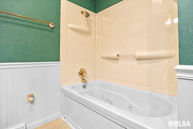 bathroom featuring tile patterned flooring and tub / shower combination