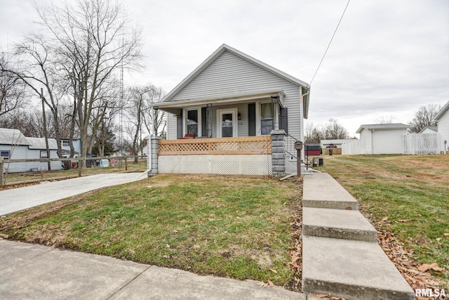 bungalow-style house with a porch and a front yard