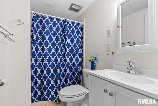 full bath featuring visible vents, a textured ceiling, vanity, and toilet