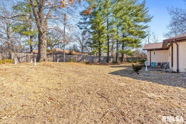 view of yard featuring a patio area and fence