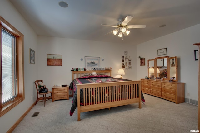 carpeted bedroom with ceiling fan