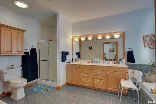 bathroom featuring tile patterned floors, vanity, toilet, and an enclosed shower