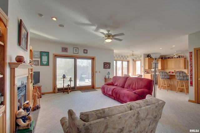 living room featuring ceiling fan and light carpet