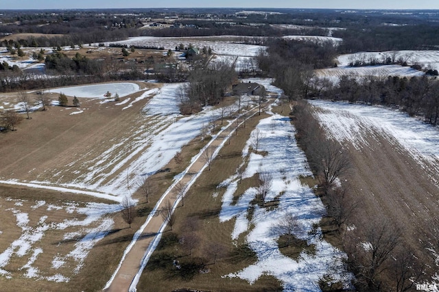 snowy aerial view featuring a rural view