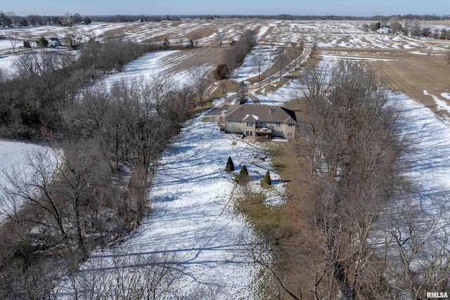 snowy aerial view featuring a rural view