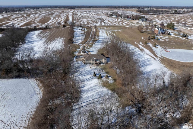 snowy aerial view featuring a rural view