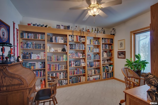 carpeted office featuring ceiling fan