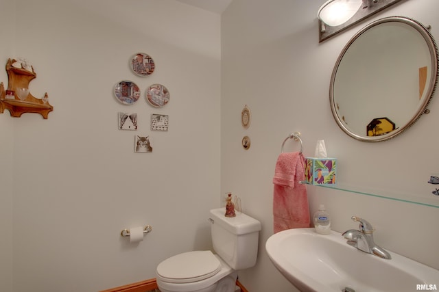 bathroom with sink and toilet