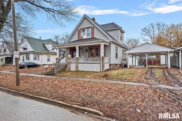 view of front facade with a carport and covered porch