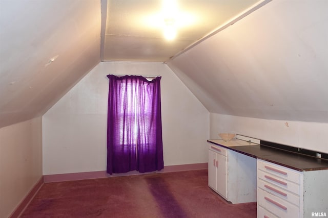 unfurnished office with lofted ceiling and carpet