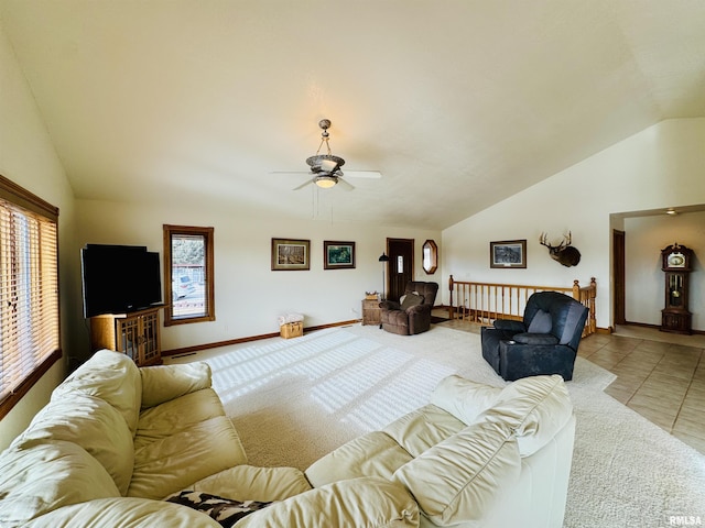 tiled living room with vaulted ceiling and ceiling fan