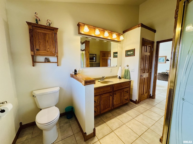 bathroom featuring tile patterned floors, toilet, and vanity